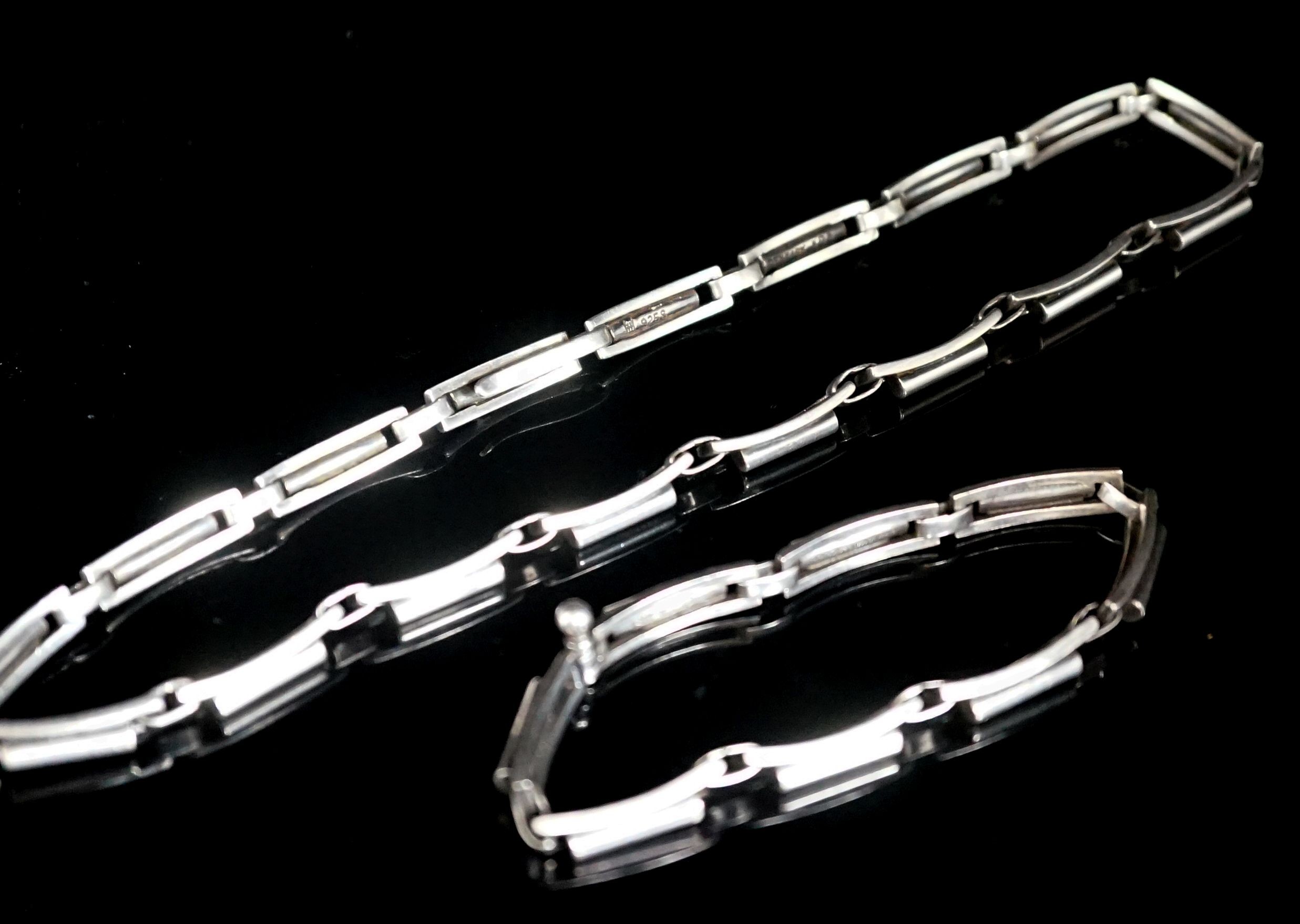 A Danish sterling 925 necklace, by Hans Hansen no 303, 38cm and a similar bracelet by Hans Hansen, no. 231, 18cm.